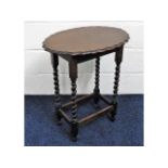 An oval oak occasional table with piecrust edge &