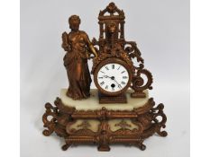 A 19thC. French gilt clock, 14in high