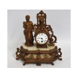 A 19thC. French gilt clock, 14in high