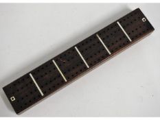 An antique rosewood cribbage board with mother of