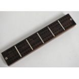 An antique rosewood cribbage board with mother of