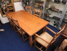 A modern oak dining suite comprising one heavy tab
