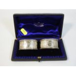 A cased pair of 1897 London silver napkin rings by
