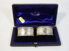 A cased pair of 1897 London silver napkin rings by