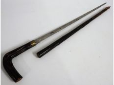 A wooden sword stick, the sword once being part of