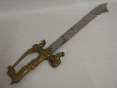 A reproduction Saudi beheading sword with brass ha