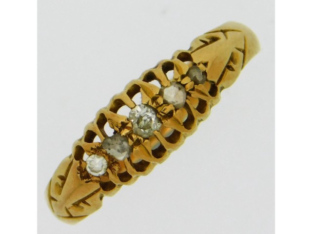 An 18ct gold ring set with five diamonds, size K, 2.1g, approx. 0.16ct carat diamond