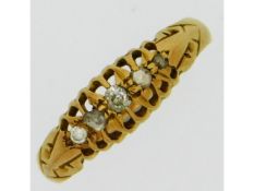 An 18ct gold ring set with five diamonds, size K, 2.1g, approx. 0.16ct carat diamond