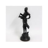 A 20thC. bronze figure of a woman, 17.5in tall