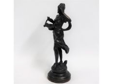 A 20thC. bronze figure of a woman, 17.5in tall