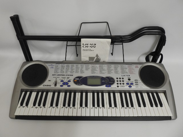 A Casio LK43 keyboard with stand