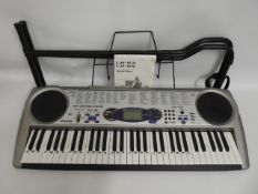 A Casio LK43 keyboard with stand