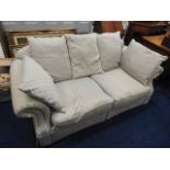 A two seater upholstered sofa, some damp staining