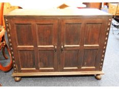 A low level oak two door cupboard, 38in wide x 17.