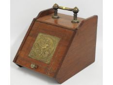 A mahogany coal scuttle with brass fittings