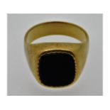 A gents yellow metal signet ring, tests electronically as 9ct gold gold, set with onyx, size W, 9.05