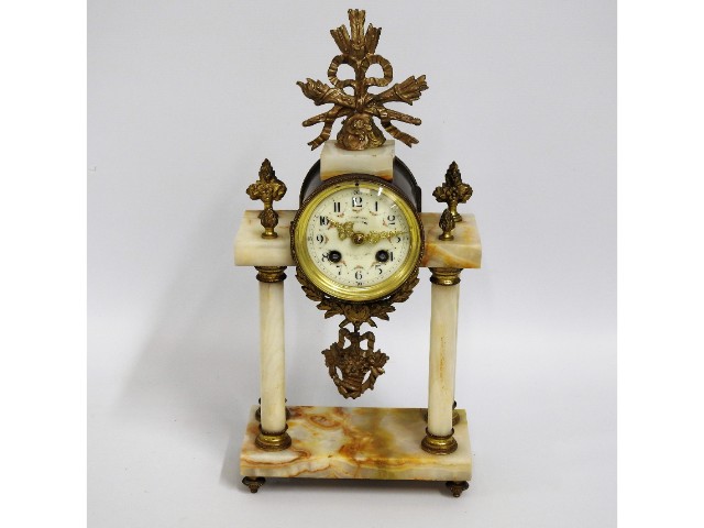 A 19thC. portico style clock on marble base & pill