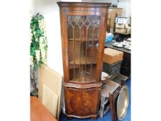 A glazed mahogany corner cabinet, 71in high x 23in