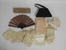 A satin handbag, a quantity of lace inc. collars &