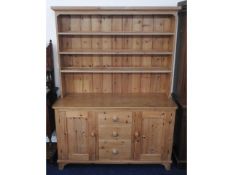 A large farmhouse pine dresser, 84in high x 60.5in