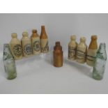 Nine stoneware ginger beer bottles including Poppl