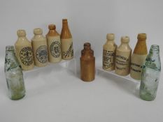 Nine stoneware ginger beer bottles including Poppl