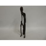 A decorative bronze African figure, 13.75in tall