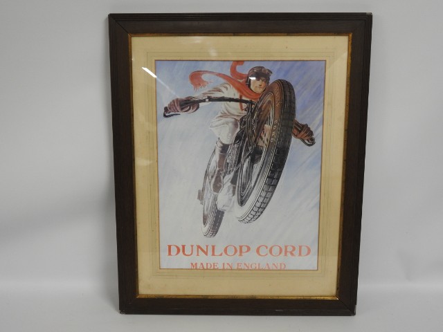 A framed reproduction of a Dunlop print
