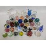 A collection of glass paperweights & other art gla