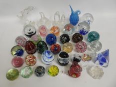 A collection of glass paperweights & other art gla