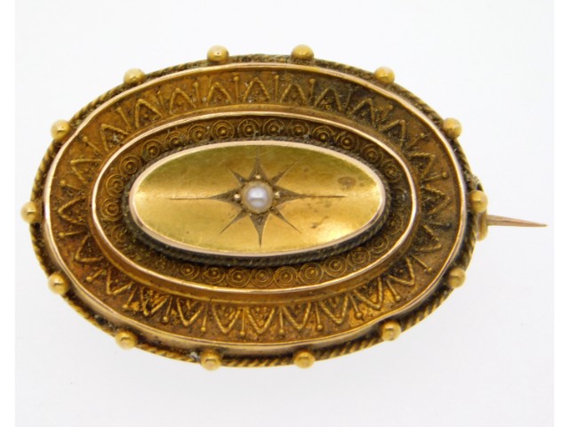 An antique 15ct gold mourning brooch set with pear