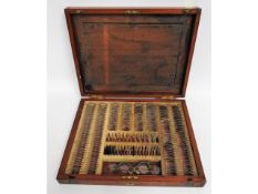 An antique opticians case with lenses