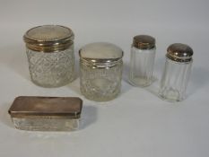 Five silver topped glass jars & dressing table tid
