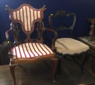A decorative antique armchair, seat a/f twinned with a Victorian dining chair