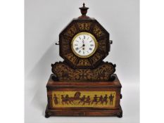 A rosewood & brass clock with inlaid brass Cossack