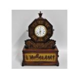 A rosewood & brass clock with inlaid brass Cossack