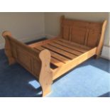A pine double sleigh bed