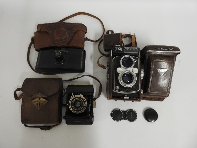 A Yashica Mat LM twin lens camera, a Purma Special
