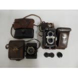 A Yashica Mat LM twin lens camera, a Purma Special