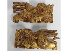 A pair of 19thC. Chinese gilded carved wood roof f