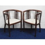 A pair of Edwardian mahogany tub chairs, 29.5in hi