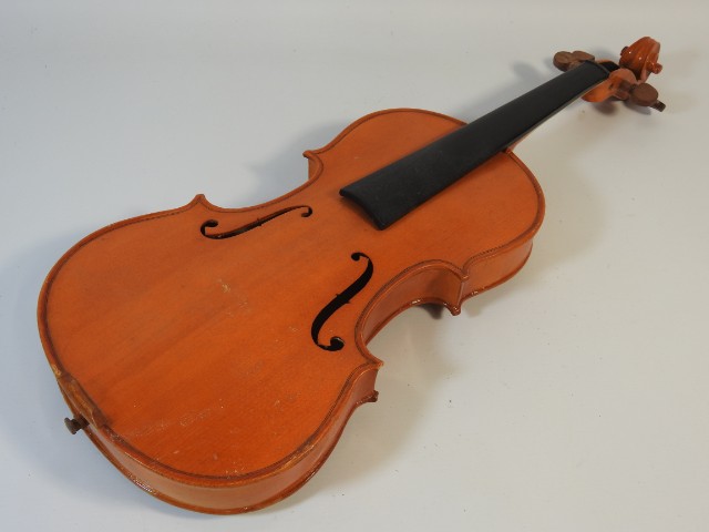 A Stentor Music Co. student violin, lacking strings, chin rest, bridge, tail piece, one peg, neck sn