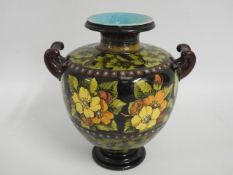 An antique floral Doulton & Co. vase, 7.75in tall
