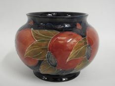 A Moorcroft pottery pomegranate vase, green signat