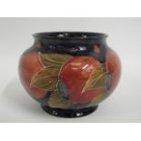 A Moorcroft pottery pomegranate vase, green signat