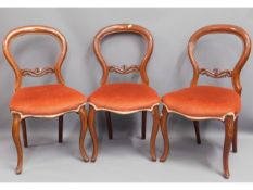 Three Victorian mahogany balloon back chairs