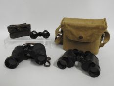 A pair of military issue binoculars twinned with K