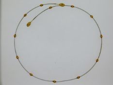 A white & yellow metal choker, electronically tests as 9ct gold, 4.2g