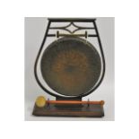 A wooden mounted brass gong, 13.5in tall