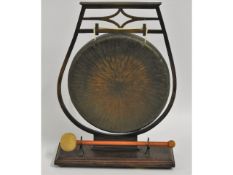 A wooden mounted brass gong, 13.5in tall